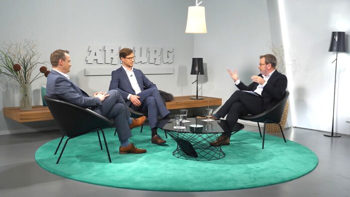 In the studio, Stephan Reich (left), Arburg Divisional Manager IT Digital Solutions and Peter Kowalewski (centre), Arburg Team Manager Industrial Solutions Support, discuss the opportunities and risks of digitalisation with presenter Guido Marschall.